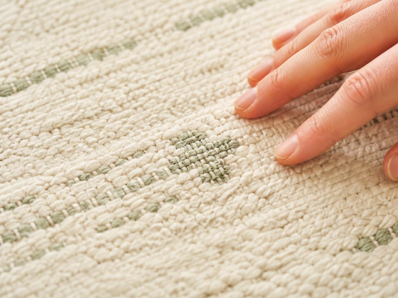 Macro close-up of the woven organic cotton pile of a Tufti rug